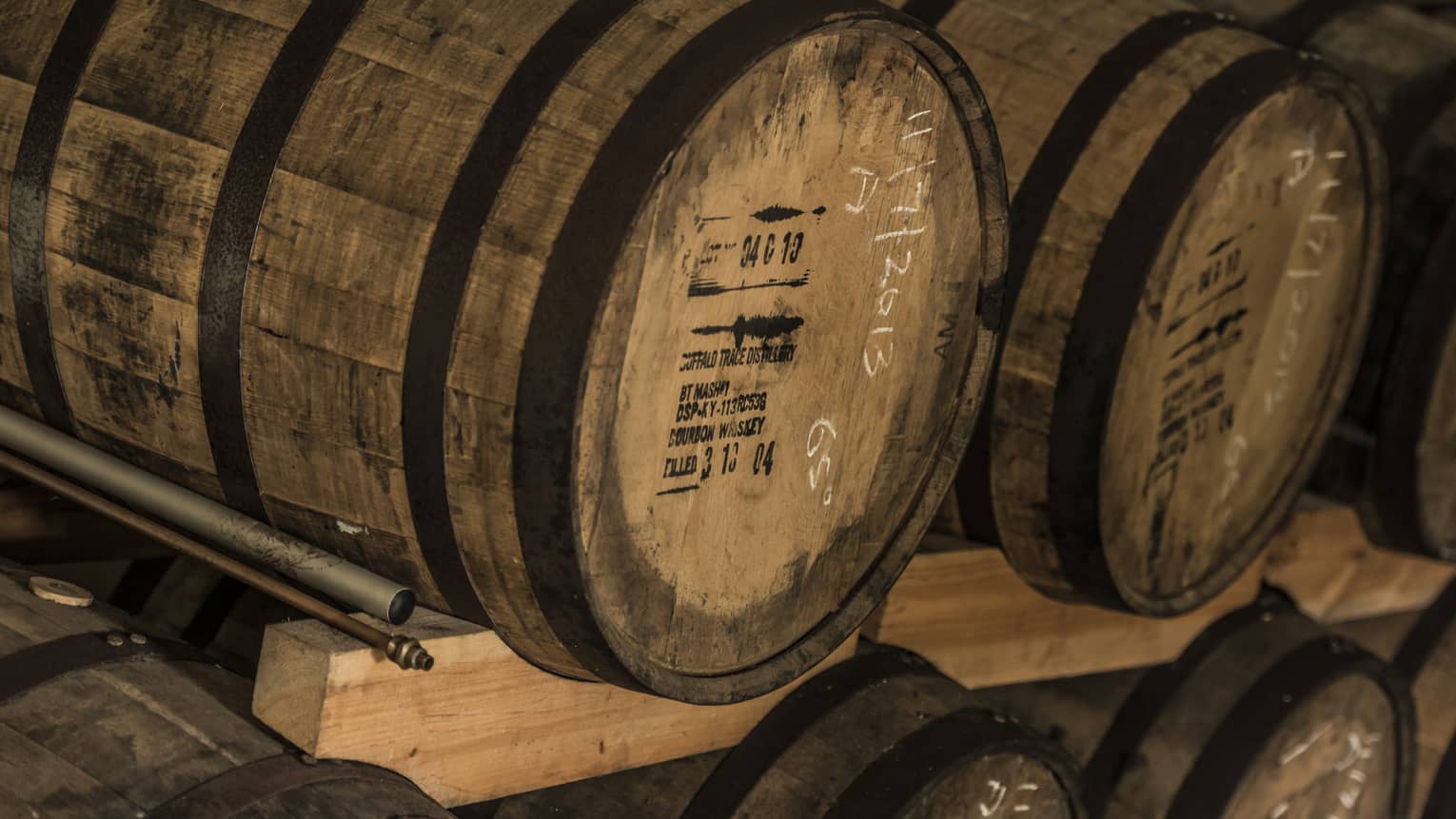 Rows of stacked rum barrels