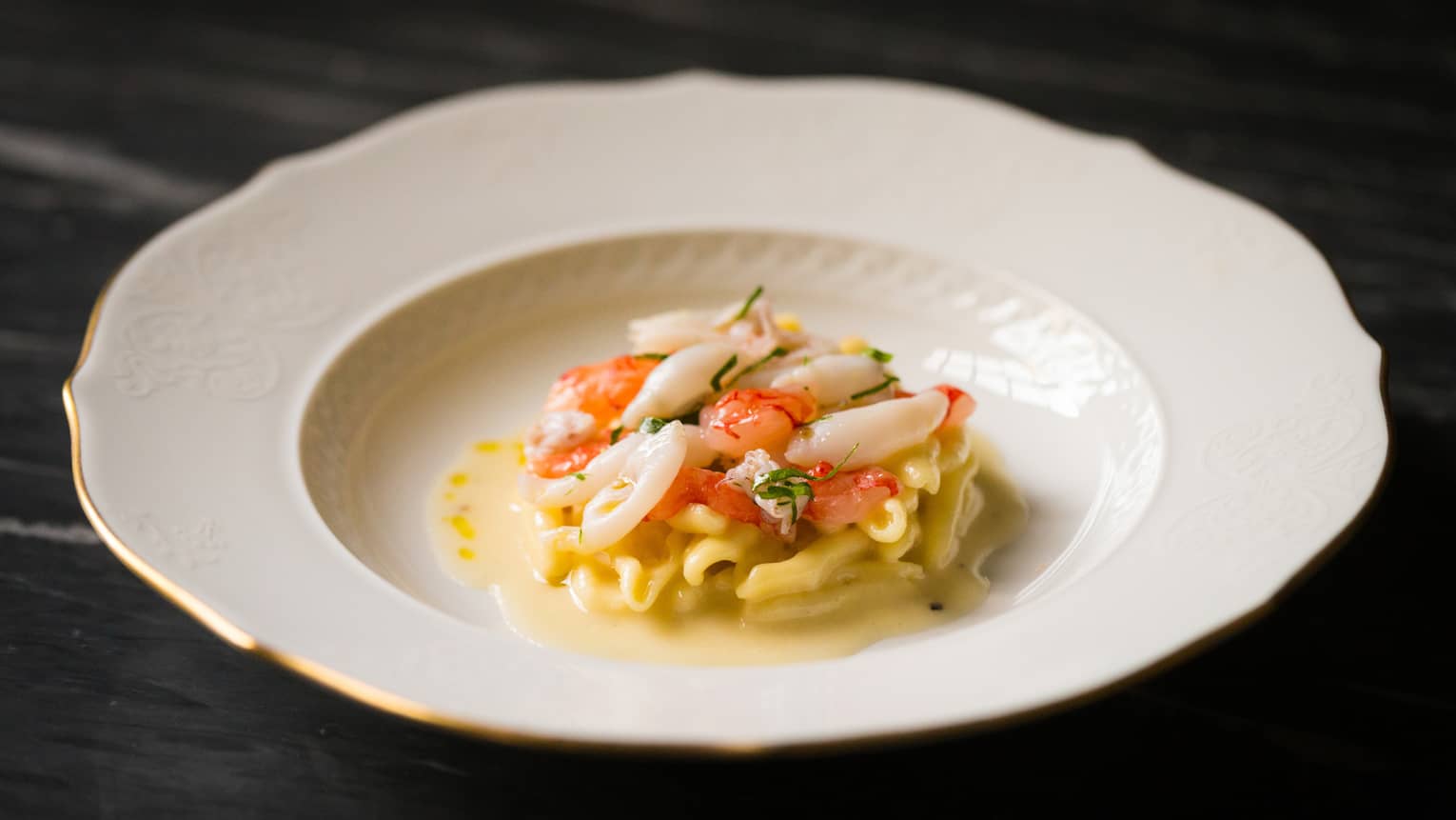 Seafood pasta in white dish