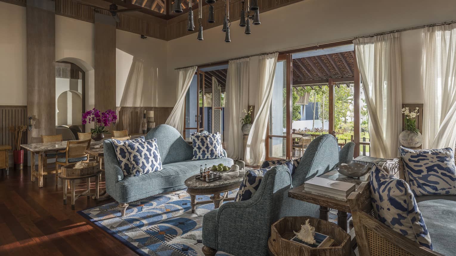 Three Bedroom Villa living room with two soft blue couches and airy views