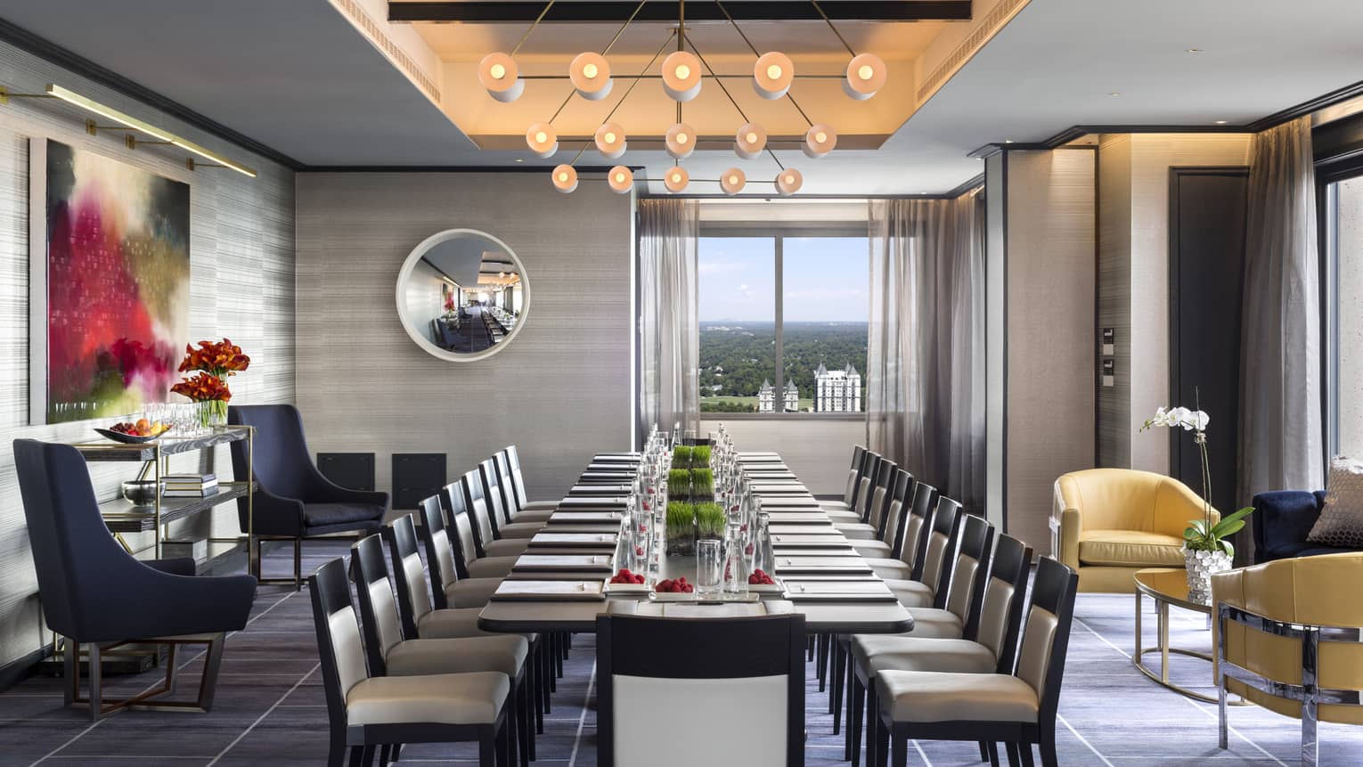 Penthouse Ballroom with long corporate meeting table, chairs and modern decor 