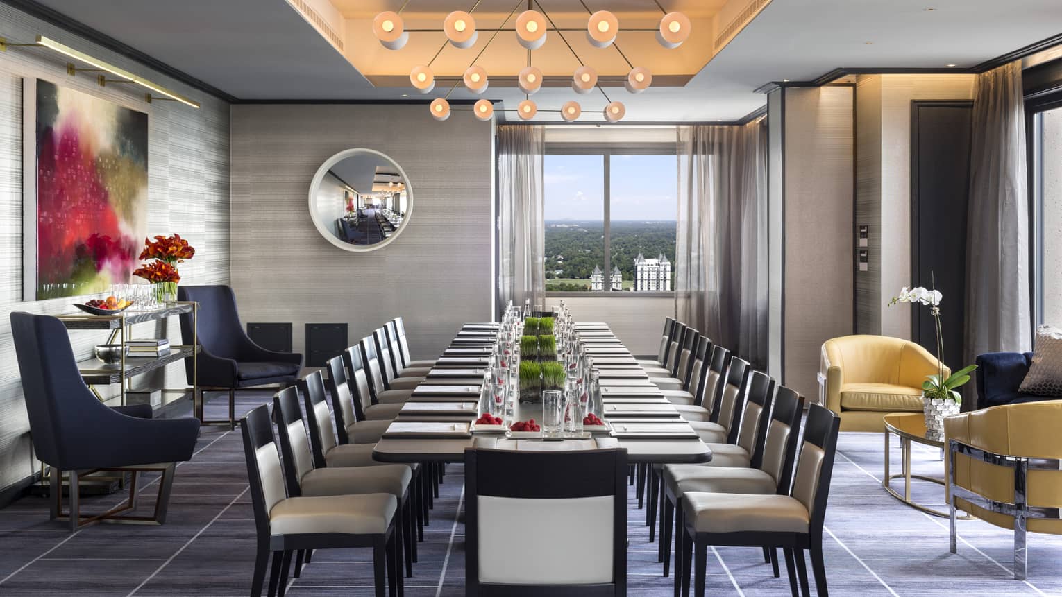 Penthouse Ballroom with long corporate meeting table, chairs and modern decor 