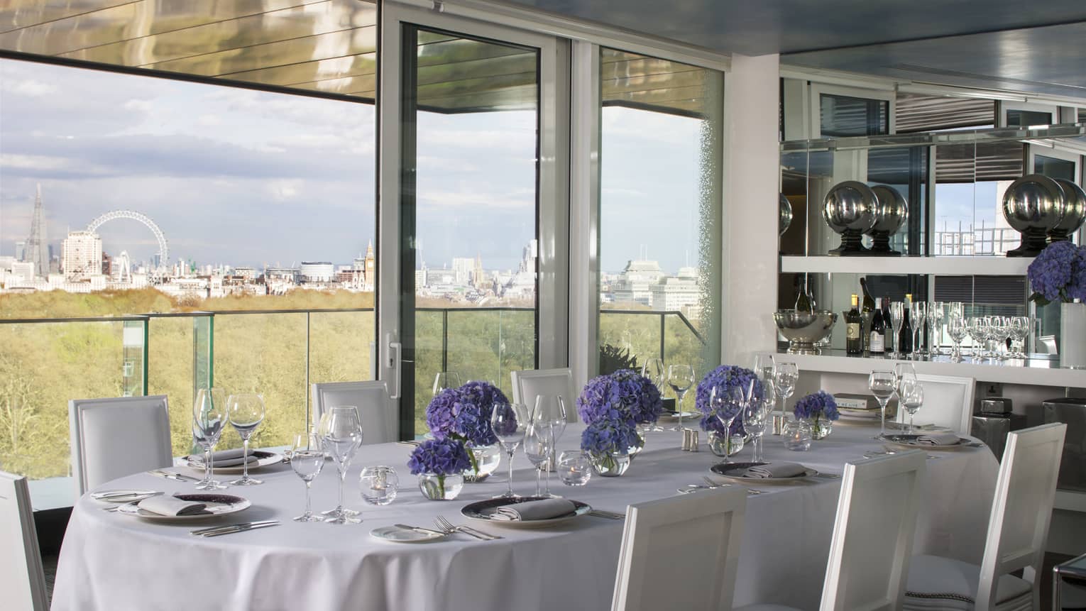 Private dining table along sunny window with London views in Tenth Floor Lounge 