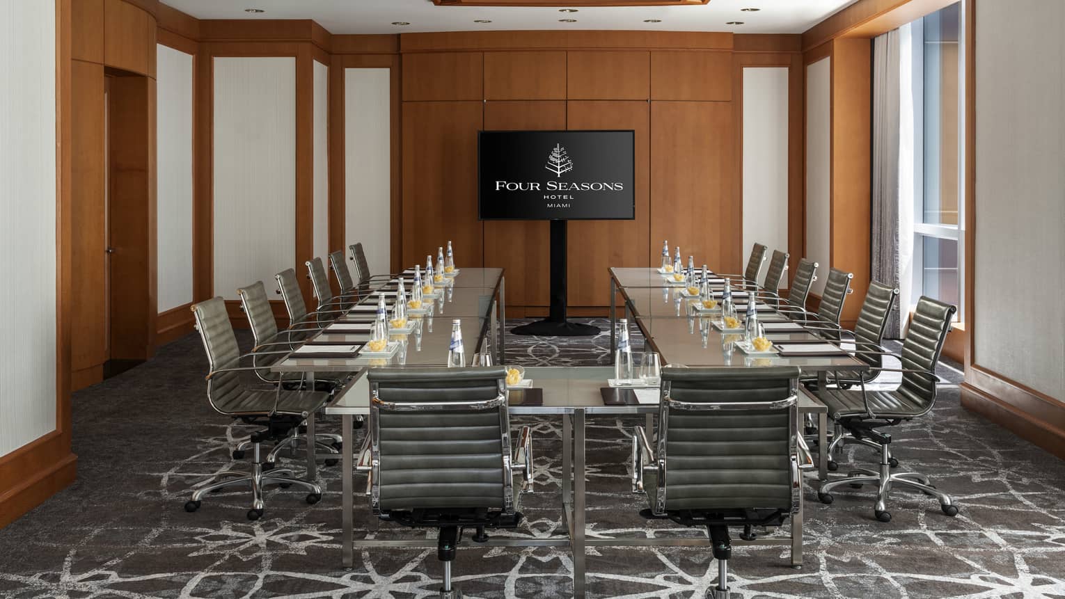 Modular meeting table lined with chairs in Key Biscayne Meeting Room
