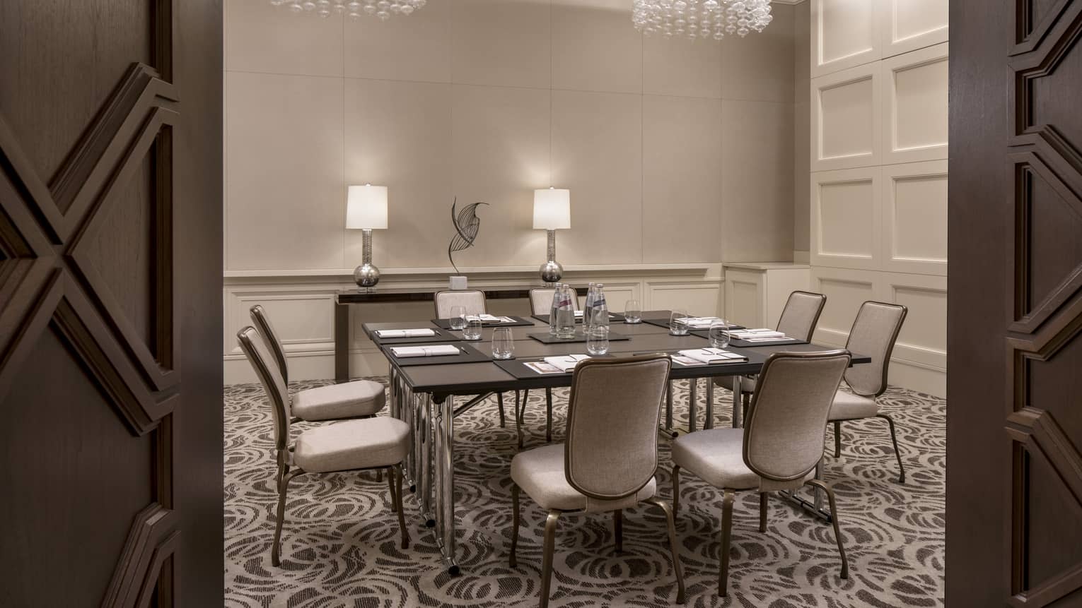 View through doors to small meeting table in Pindo room