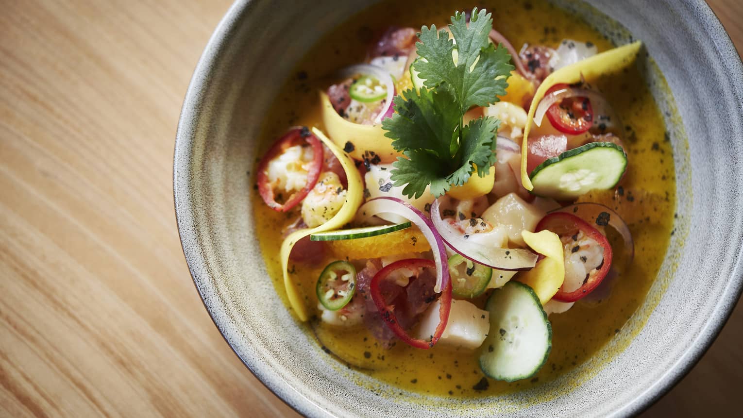 Aerial view of fresh ceviche summer dish with shaved vegetables