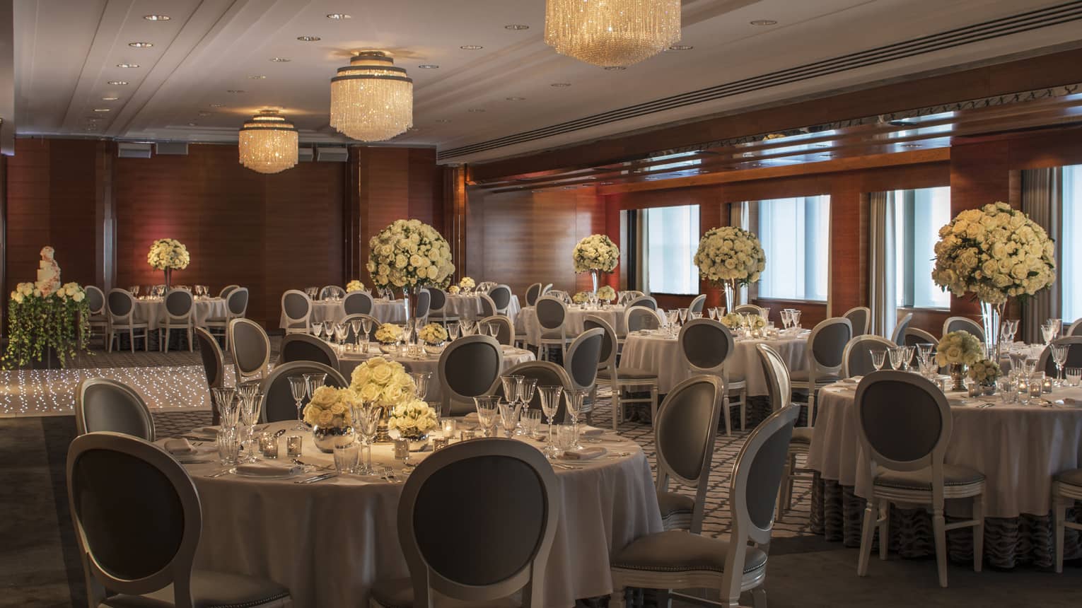 Meeting room with round banquet tables set for wedding