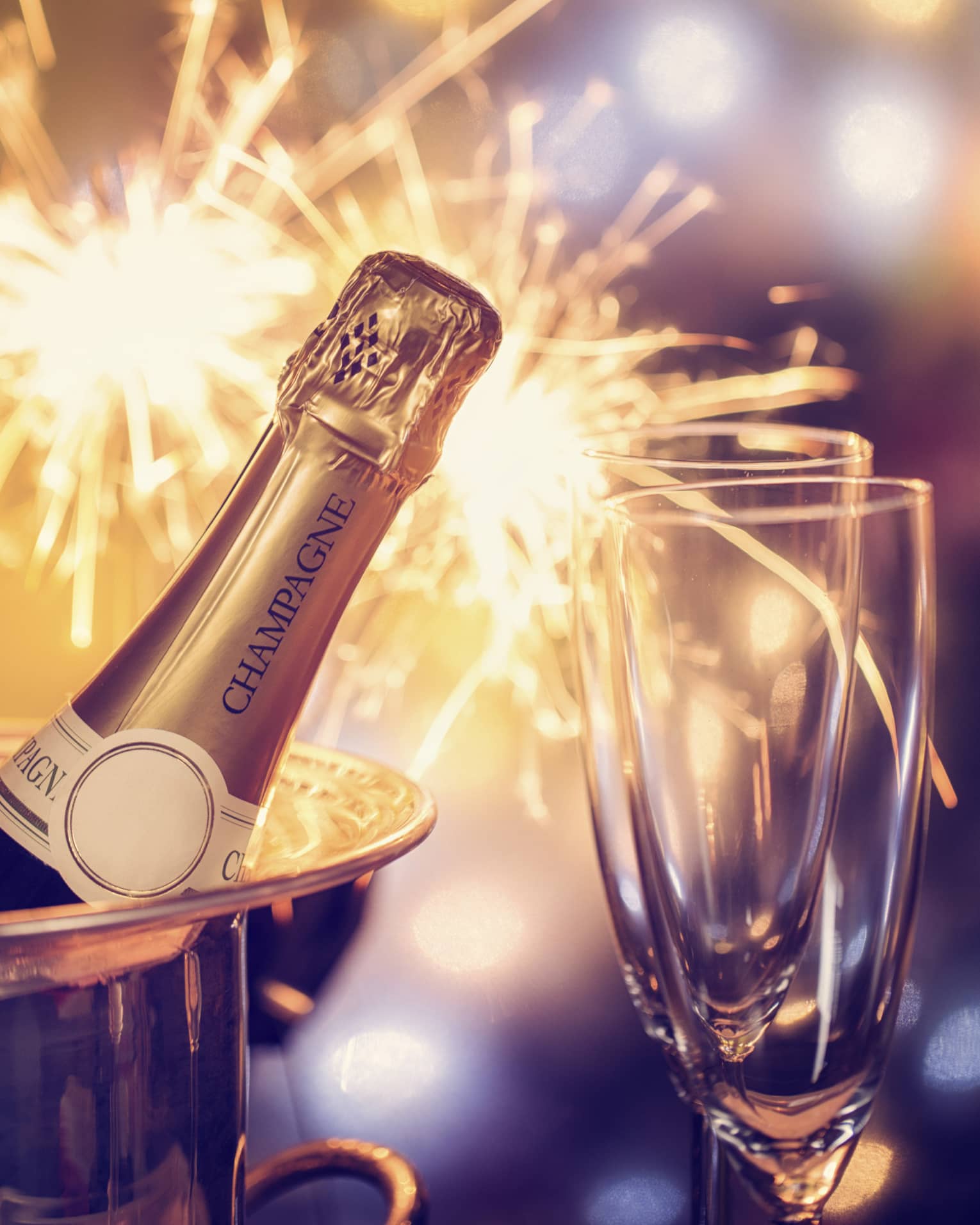 Fireworks, champagne and two champagne flutes