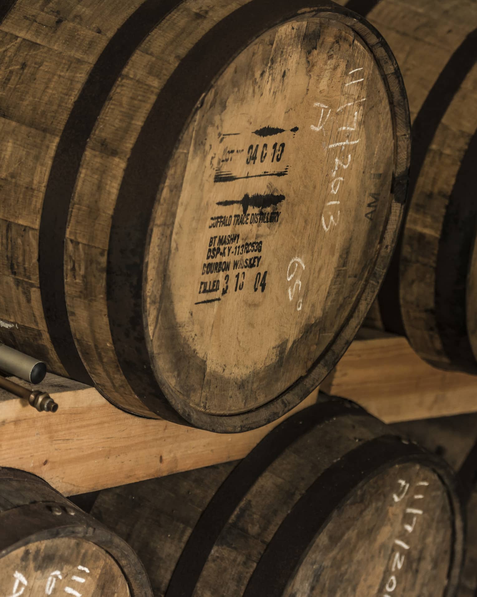 Rows of stacked rum barrels