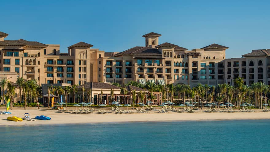 Exterior view of building, sand beach at Four Seasons Resort Dubai at Jumeirah Beach